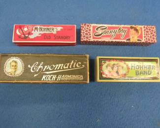 Lot 153. Four empty harmonica boxes in VGC to excellent condition: Koch Chromatic hinged box. Hohner two-piece Sonny Boy box. The Hohner-Band hinged box. M. Hohner's "Old Standby".