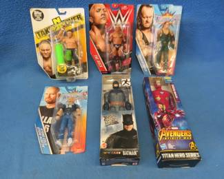 Lot 329. Six figurines. Four wrestling, Iron Man, and Batman.