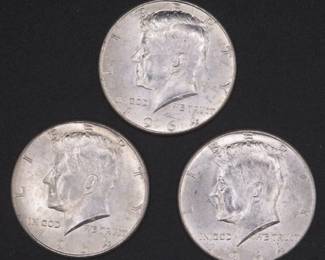 Lot 132. Three 1964 Kennedy Half Dollars that came to us in an unopened bank roll