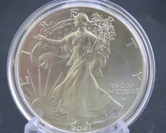 Lot 182. Uncirculated and encapsulated 2021 Silver Eagle with the the flying eagle on the reverse