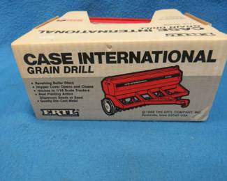 Lot 246. 1989 Ertl 1:16 scale die-cast grain drill, Tru-Scale manure spreader, and a trailer