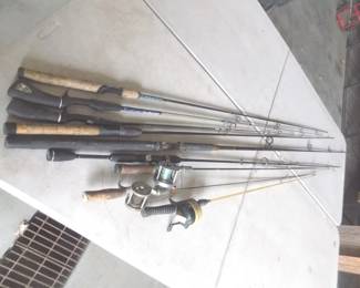 Lot 393. They're biting! Nine rods and three reels. Check photos for tips