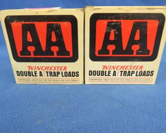 Lot 385. Two vintage AA shotgun shell boxes. Each box contains 25 mixed AA shotgun shells. These shells may be reloads. AS-IS. Use at your own risk.