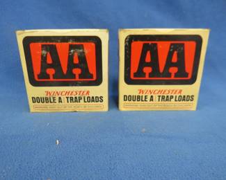 Lot 387. Two vintage AA shotgun shell boxes. Each box contains 25 mixed AA shotgun shells. These shells may be reloads. AS-IS. Use at your own risk.