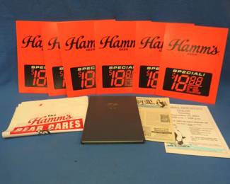 Lot 118. Hamm's collectibles including price signs, litter bags, Hamm's Club book, and more