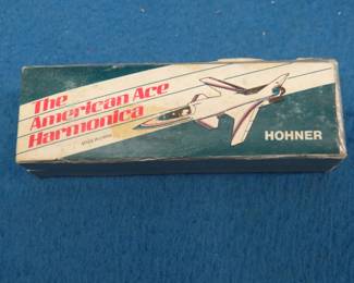 Lot 52. Sounds great. Hohner The American Ace 10-hole diatonic harmonica in the key of C. The box, paper, and harmonica are in excellent condition. Sounds great.