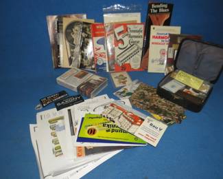 Lot 259. Treasure trove of harmonica ephemera including how to books, photos, some collectible pins and a copper photo engraved advertising plate for "The Popular Richter" made in Germany