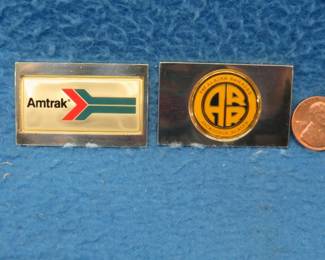 Lot 316. Two sterling silver ingots from "The Great American Railroad Emblems" series. The Amtrak and the Alaska. Total weight 46.18 grams.