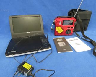 Lot 68. Phillips portable DVD player, and a Grundig Crank Radio. Both power up