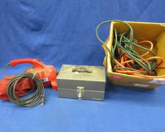 Lot 217. Dirt Devil vacuum, extension cords, and more