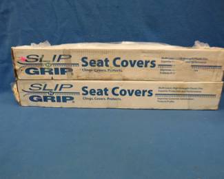 Lot 72. Slip-N-Grip disposable seat covers used by mechanics. One full box and one box that appears to be 99% full.