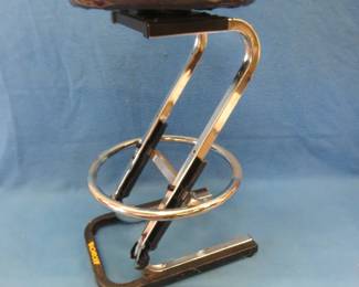 Lot 355. 29" Monroe Shock themed shop stool in very good condition