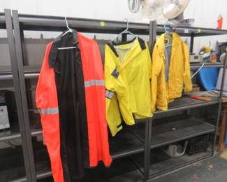 Lot 306. Three raincoats. An XXL, a medium, and an unsized one.