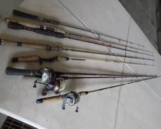 Lot 398. They're biting! Eight rods and three reels. Check photos for tips