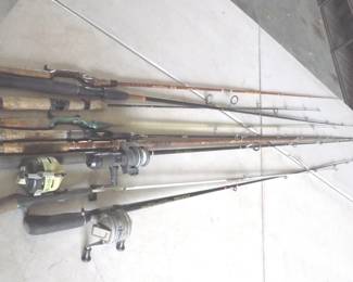 Lot 396. They're biting! Nine rods and three reels. Check photos for tips