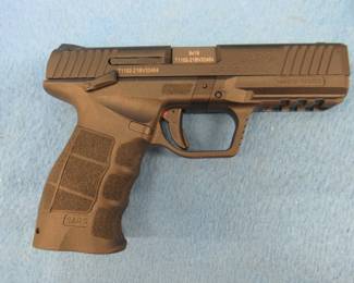 Lot 343. Sarsilmaz SAR-9 semi-auto 9mm pistol. S/N T1102-21BV32464. Owner states it's never been fired. Includes case, two magazines, two extra sets of side grips, two extra backstraps, cleaning brush, and manual.