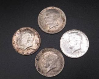 Lot 88. Four 1964 P Kennedy Half Dollars. These were ender coins on two bank rolls, so they are high grade on one side