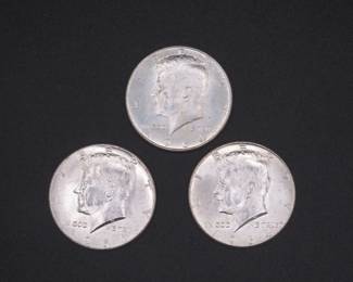 Lot 231. Three Kennedy 1964 Half Dollars that came to us in an unopened bank roll.