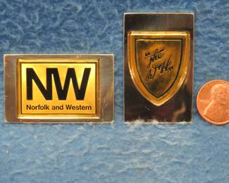 Lot 314. Two sterling silver ingots from "The Great American Railroad Emblems" series. The Norfolk and Western and the Delaware and Hudson. Total weight 46.36 grams.