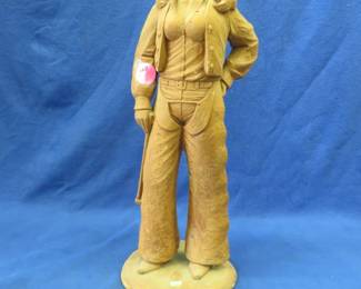 Lot 40. 25" cowgirl statue. Possible concrete composition.