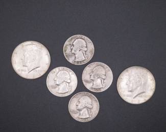 Lot 234. Two 1964 Kennedy Half Dollars and four Silver Washington Quarters