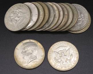 Lot 121. Fourteen 40% silver Kennedy Half Dollars