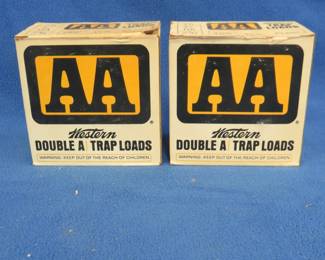 Lot 388. Two vintage AA shotgun shell boxes. Each box contains 25 mixed AA shotgun shells. These shells may be reloads. AS-IS. Use at your own risk.