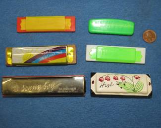 Lot 208. Five harmonicas and a salt shaker: Vintage M. Hohner Sonny Boy 10-hole diatonic harmonica. Sounds great. Please see the Auctioneer's Notes at the beginning of this auction where we list John Whitman's Harmonica Anthology 11th Ed. April 25, 2019 as a free and easy source to get more information about specific harmonicas. The harmonica in this lot or one like it can be found at page 242. Three plastic toy harmonicas. Jesus Loves You harmonica. Harmonica salt shaker.