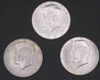 Lot 130. Three 1964 Kennedy Half Dollars that came to us in an unopened bank roll