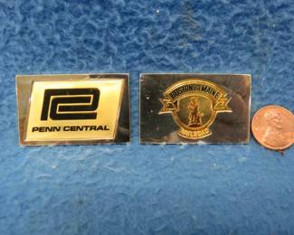 Lot 318. Two sterling silver ingots from "The Great American Railroad Emblems" series. The Penn Central and the Boston and Maine. Total weight 47.03 grams.