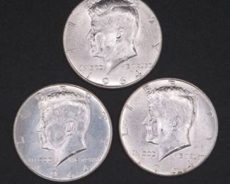 Lot 241. Three Kennedy 1964 Half Dollars that came to us in an unopened bank roll.