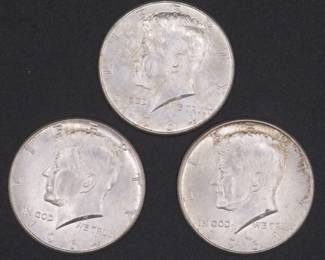 Lot 131. Three 1964 Kennedy Half Dollars that came to us in an unopened bank roll