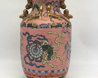 Chinese polychrome porcelain vase with pink ground and gilt handles