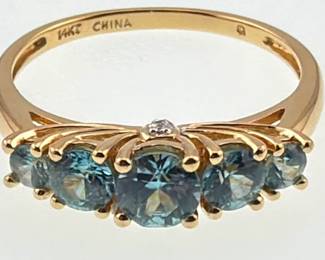 Blue topaz and 14kt five stone ring with diamond accents