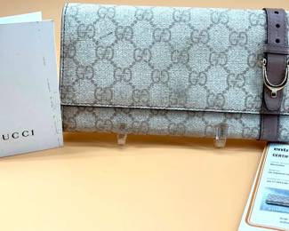 Gucci leather long wallet with GG monogram pattern and pink leather trim