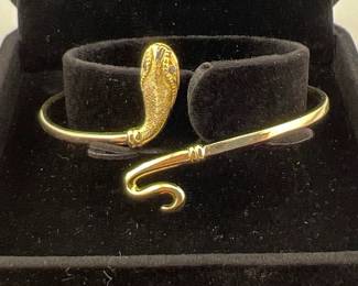 14kt snake design bracelet with blue sapphire eyes