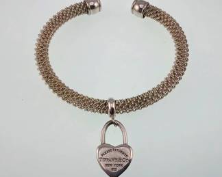 Tiffany and Co. sterling silver mesh cuff with dangle padlock heart
