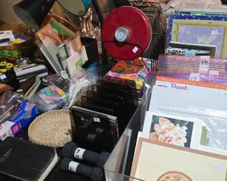 Basement desk area has office supplies and vintage paper.  There are scrapbooks, old photos and vintage paper.  Family has all the photos they want.  These are extra!