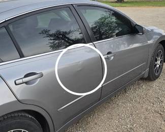 Circled body damage.
