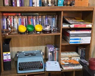 Basement right desk area.  DVDs are here as well as a vintage typewriter. 