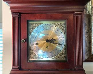 #22	Mantle clock by Howard Miller w key and paperwork 14x19"	 $200.00 