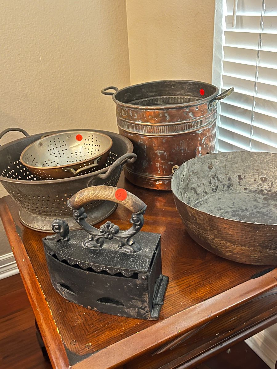 Antique copper pots and cast iron