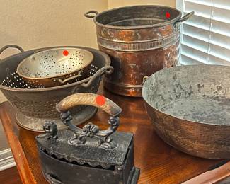 Antique copper pots and cast iron