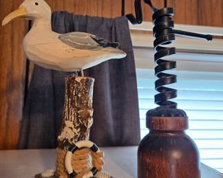 Carved Wooden Seagull Figurine and Metal Spiral Object