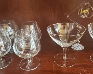 Assorted Glassware Collection including Brandy Snifters, Martini Glasses, Shot Glasses, Tumblers, and Crystal Creamer & Sugar Set