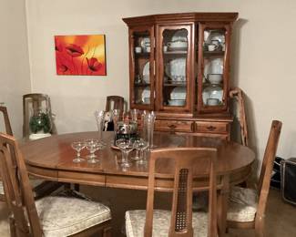 Mid century dinning table with six chair. Mid century china cabinet.