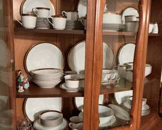 Stunning China set with serving bowls salt and pepper shakers .