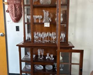 Display Cabinet with wood shleves, Waterford crystal and glass serving dishes