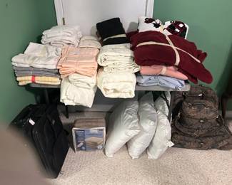 pillows, luggage, sheets, blanketsk