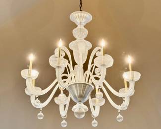 Contemporary Murano Glass chandelier with 8 gracefully curved arms, each with a ribbon dangling sphere. 44" Diam. x 42" H